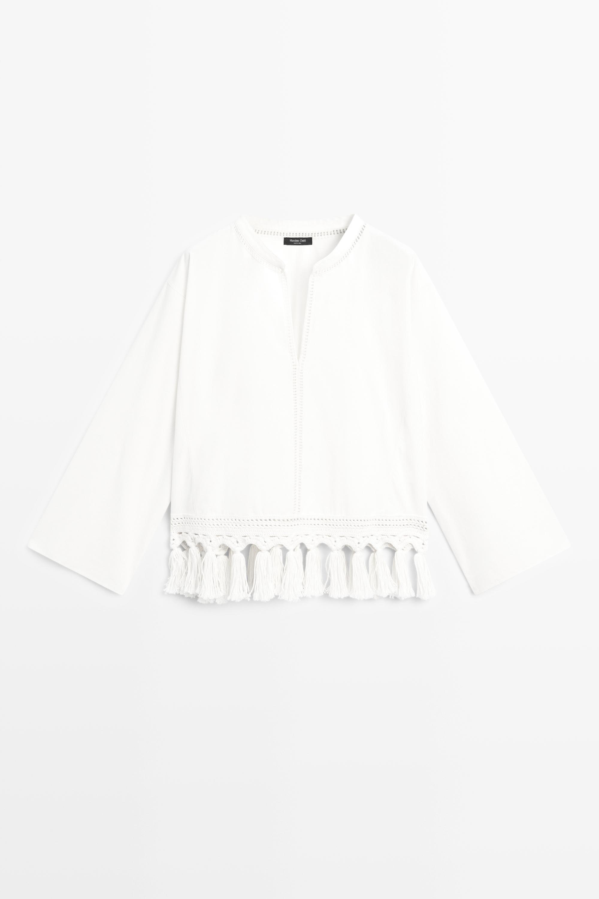 Embroidered blouse with fringed hem